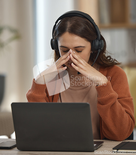 Image of Woman, home and call center stress or headache for telemarketing fail, communication fatigue and sales job. Young worker, telecom agent or virtual consultant with depression, tired or pain on laptop