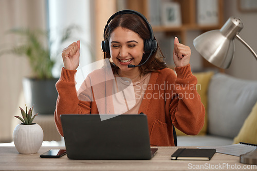 Image of Happy woman, laptop and fist pump in call center, celebration or winning promotion in remote work at home. Excited female person, consultant or agent freelancer smile for discount, sale or target