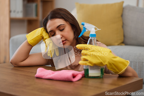 Image of Tired maid woman, table and home on floor with cloth, gloves or bottle for detergent spray for spring cleaning. Burnout, fatigue and cleaner with soap in house for sleeping, rest or exhausted at desk