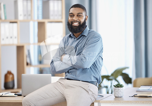 Image of Man, portrait and office on desk, arms crossed and pose for website as finance professional, smile and happy. Business, management and startup investment capital for corporate venture and employee