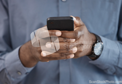 Image of Phone, hands and closeup of businessman typing a message on the internet or mobile app. Technology, networking and African male person scroll on social media or website with cellphone in the office.