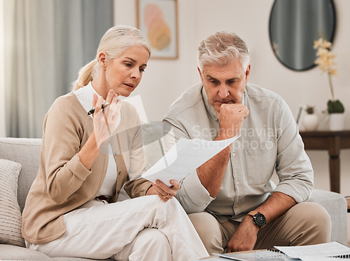 Image of Mature, couple and documents for planning with discussion for retirement, budget or vacation at home. Man, woman and married with paperwork of finances, banking or stocks with opportunity for growth