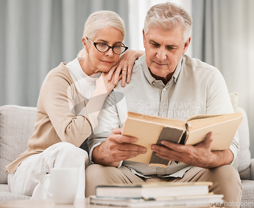 Image of God, worship and senior couple with bible on a sofa relax with scripture, study or reading in their home. Holy, book and retired people in a living room with gospel, faith and Jesus Christ praise