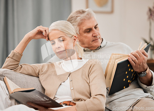 Image of Old couple, relax on sofa and reading book, retirement and support with time together at home. People in living room, knowledge and literature, leisure and hobby with love and comfort with story