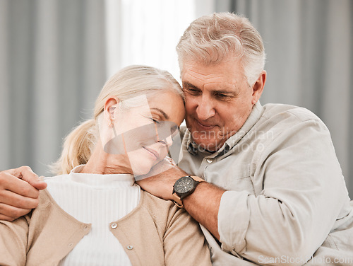 Image of Old people, hug and relax on sofa with love and support, bonding while at home with trust and comfort. Couple with time together, marriage or life partner with retirement, calm and peace of mind