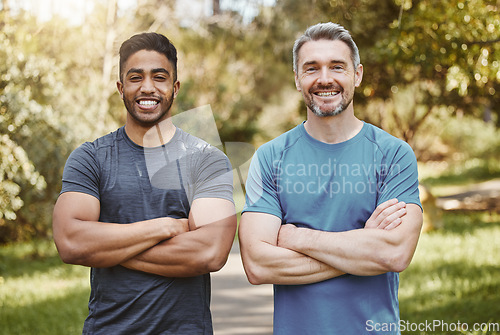 Image of Men, arms crossed and together in portrait, fitness and health and ready for workout, training or summer. Partnership, personal trainer and outdoor sunshine for exercise, smile and wellness in nature