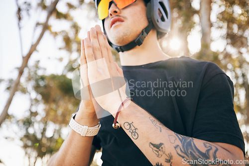 Image of Man, hands and prayer with hiking in nature, mindfulness and meditation with bike by mountain. Caucasian guy, athlete and gratitude with mental health in forrest, natural landscape and vacation