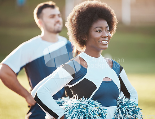 Image of Cheerleader team, sports and black woman on field for performance, dance and motivation for game. Teamwork, dancer and happy people cheer for support in match, competition and sport event outdoors