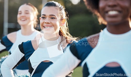 Image of Cheerleader team, sports and women on field for performance, dance and motivation for game. Teamwork, dancer and people in costume cheer for support in match, competition and sport event outdoors