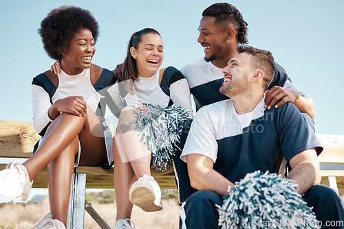 Image of Cheerleader, sports and people laugh on bench for performance, dance and motivation for game. Teamwork, dancer and people laugh in costume for support in match, competition and field event outdoors