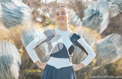 Image of Cheerleader, sports and portrait of woman with blur for performance, dance and motivation for game. Teamwork, dancer and person in costume cheer for support in match, competition and event outdoors