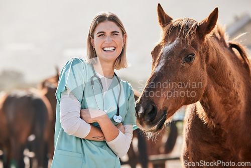Image of Happy horse doctor, portrait and woman at farm with arms crossed, care or smile for love, animal or nature. Vet, nurse and equine healthcare expert in sunshine, countryside and helping for wellness