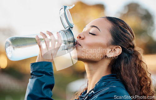 Image of Outdoor, fitness and woman drinking water, health and workout with hydration, wellness and sports. Person outdoor, girl and athlete with liquid, bottle and thirsty with nutrition, detox and exercise