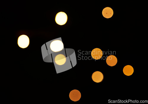 Image of Gold, bokeh and mockup with lights on dark background for New Year, Christmas or festive fireworks celebration at night. Mock up, space and sparkle with magic glow or shine on black backdrop