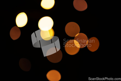 Image of Gold, bokeh and mockup with lights on dark background for New Year, Christmas or festive fireworks celebration at night. Mock up, space and star in winter with magic, glow or shine on black backdrop