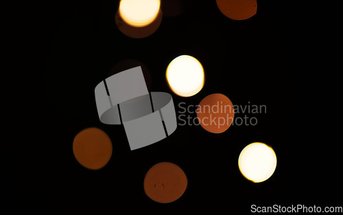 Image of Gold, lights and bokeh on dark blurred background for New Year, Christmas or festive fireworks celebration at night. Mock up, space and sparkle in winter with magic, glow or shine on black backdrop