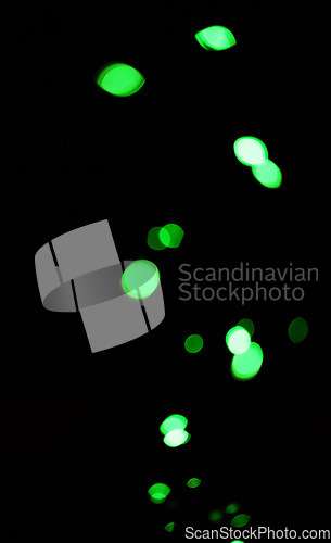 Image of Bokeh, green dots and lights on black background with pattern, texture and mockup with cosmic aesthetic. Night lighting, sparkle particles and glow on dark wallpaper with space, color shine and flare