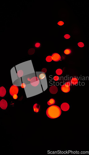 Image of Bokeh, red and orange lights on black background with pattern, texture and mockup with cosmic aesthetic. Night lighting, sparkle particles and glow on dark wallpaper with space, color shine and flare