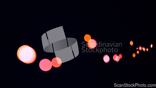 Image of Bokeh, red color dots and black background with pattern, texture and lights on mockup with cosmic aesthetic. Night lighting, sparkle particles and glow on dark wallpaper with space, shine and flare.