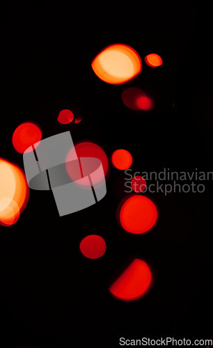 Image of Bokeh, red and orange lights on dark wallpaper with pattern, texture and mockup with cosmic aesthetic. Night lighting, sparkle particles and glow on black background with space, color shine and flare