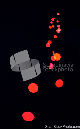 Image of Bokeh, red lamp dots and black background with pattern, texture and mockup with cosmic aesthetic lights. Night lighting, sparkle particles and glow on dark wallpaper with space, color shine and flare