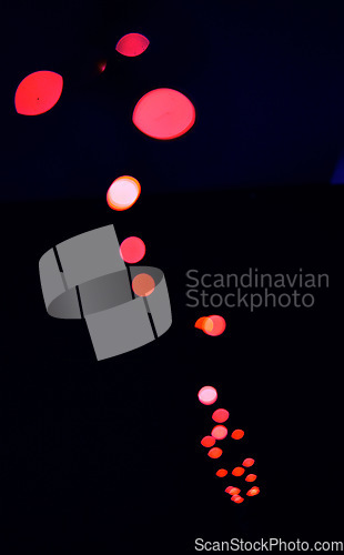 Image of Bokeh, red lamp lights on black background with pattern, texture and dots mockup with cosmic aesthetic. Night lighting, sparkle particles and glow on dark wallpaper with space, color shine and flare.