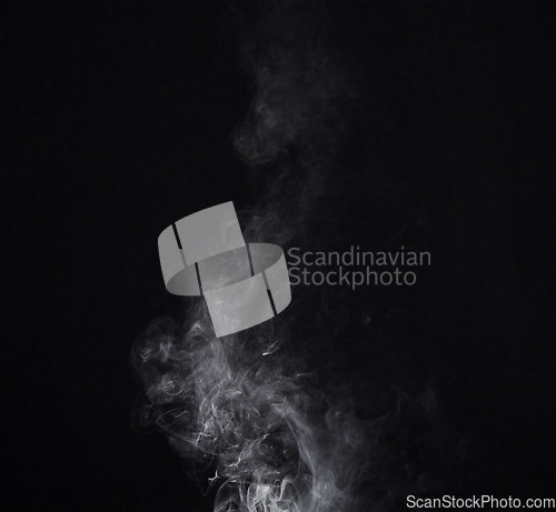 Image of Smoke, smog or gas in a studio with dark background by mockup space for magic effect with abstract. Incense, steam or vapor mist moving in air for cloud fog pattern by black backdrop with mock up.