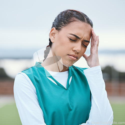 Image of Sports, headache or face of girl on hockey field for fitness, exercise game or workout emergency. Tired woman, stress anxiety or sick athlete with migraine, injury or head pain frustrated by training