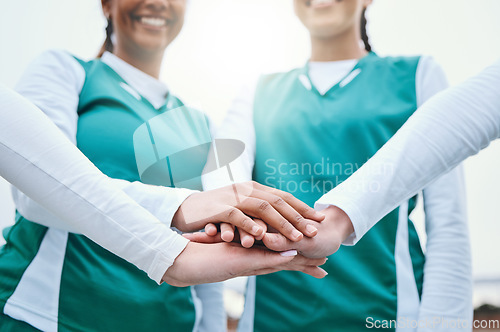 Image of Hands, sports women or team in huddle with support, smile or plan for a hockey training game. Low angle, stack or happy female athletes in practice for exercise or match together with pride or unity