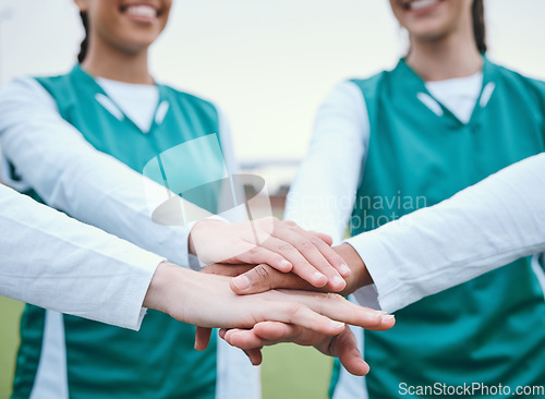 Image of Hands, sports group or team in huddle with support, smile or plan for a hockey training game. Women, stack or happy female athletes in practice for exercise or match together with pride or teamwork