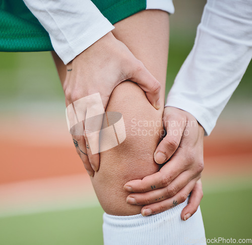 Image of Sports, knee pain or athlete with an injury on field or turf struggling with fracture in game or match. Fitness workout, emergency or closeup of person suffering from an accident outdoor in training