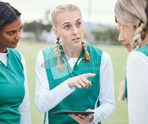 Image of Leader, sports women or team planning tactics or strategy in a hockey training game, conversation or match. Tablet, talking or athletes in practice for fitness exercise together for teamwork in group