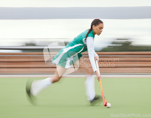 Image of Hockey, sports or woman running in game, tournament or competition with ball, stick or action on turf. Blur, training or fast girl player in exercise, workout or motion on artificial grass for speed