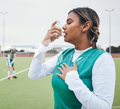 Image of Asma, hockey woman and medical tool for breathing and healthcare outdoor on sport field. Female student, fitness and exercise in a game with training and workout with breathe for wellness and stress