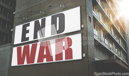 Image of Billboard, poster and information on building, wall and war, propaganda or advertising activism campaign in city. End, conflict and sign or banner to protest politics, violence or global crisis