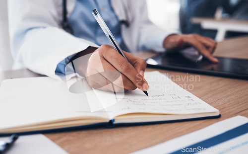 Image of Tablet, hands and doctor writing in book on table, research and planning in hospital. Technology, notebook and medical professional closeup at desk for information, healthcare journal and telehealth