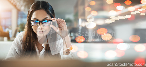 Image of Student, woman and glasses on laptop at cafe for online education, e learning or remote work on banner or bokeh overlay. Young person on computer in vision, reading and online research at coffee shop