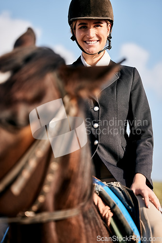 Image of Portrait, equestrian and a woman with an animal on a ranch for sports, training or a leisure hobby. Horse riding, smile or competition and a happy young rider in uniform with her stallion outdoor