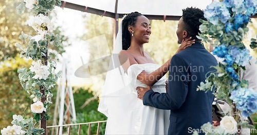 Image of Happy black couple, wedding and kiss for love, marriage or commitment in support together. Married African woman and man kissing in embrace, trust or relationship of bride or groom in outdoor romance