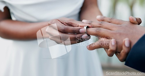 Image of Couple, holding hands and ring for marriage, commitment or wedding in ceremony, love or support. Closeup of people getting married, vows or accessory for symbol of bond, relationship or partnership