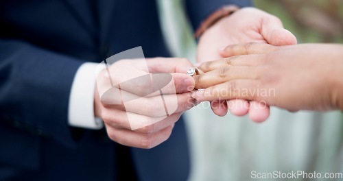 Image of Couple, hands and ring for marriage, commitment or wedding in ceremony, love or support together. Closeup of people getting married, vows or accessory for symbol of bond, relationship or partnership