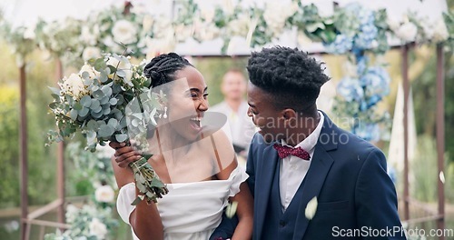 Image of Couple, flower confetti and outdoor wedding with event, walk and happy laugh in nature. Black woman, man and excited for marriage, floral bouquet or holding hands in park, party or together in aisle