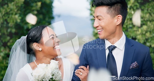 Image of Couple, flower confetti and wedding event with walk, outdoor or happy laugh in nature. Woman, Asian man and excited for marriage, floral bouquet and love with care in park, party or together in aisle