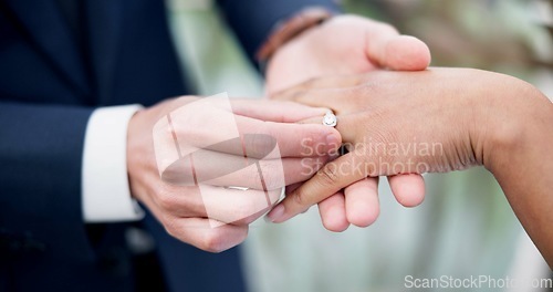 Image of Couple, hands and ring for marriage, love or wedding in ceremony, commitment or support together. Closeup of people getting married, vows or accessory for symbol of bond, relationship or partnership