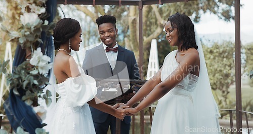 Image of Women, lesbian wedding and celebration outdoor with priest for love, ceremony and together for commitment. Gay marriage, event and party with bride, black man and African lgbtq couple in garden