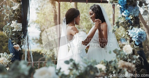 Image of Lesbian, wedding and dance in garden for celebration or love for diversity or commitment, outside and dress. Black women, married and happy with trust for event or romance, ceremony for partnership