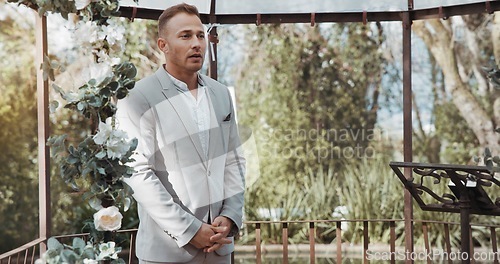 Image of Waiting, groom and man in wedding and ceremony at alter with anxiety, stress or nervous energy for marriage or commitment. Formal, suit and excited person standing in aisle with flowers and nature