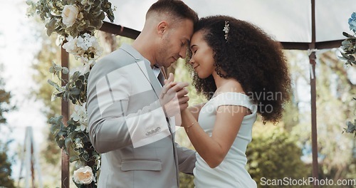 Image of Couple, wedding and dancing with touch, outdoor and commitment in celebration, love and smile. Interracial marriage, fashion and happy in nature, peace and romance of union and trust