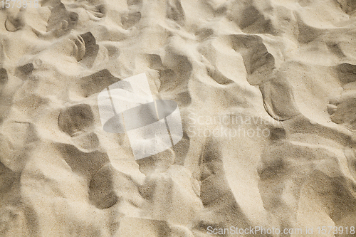 Image of yellow light sand on the seashore