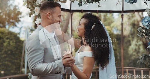 Image of Couple, wedding and dancing with touch, smile and commitment in celebration. Interracial marriage, fashion and happy in outdoor, love and romance in conversation, trust and vertical in nature or cute